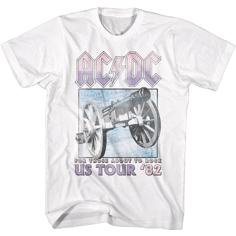 White AC/DC T-shirt featuring a pastel purple logo and a vintage-style cannon graphic with “US Tour ’82” text.