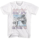 White AC/DC T-shirt featuring a pastel purple logo and a vintage-style cannon graphic with “US Tour ’82” text.