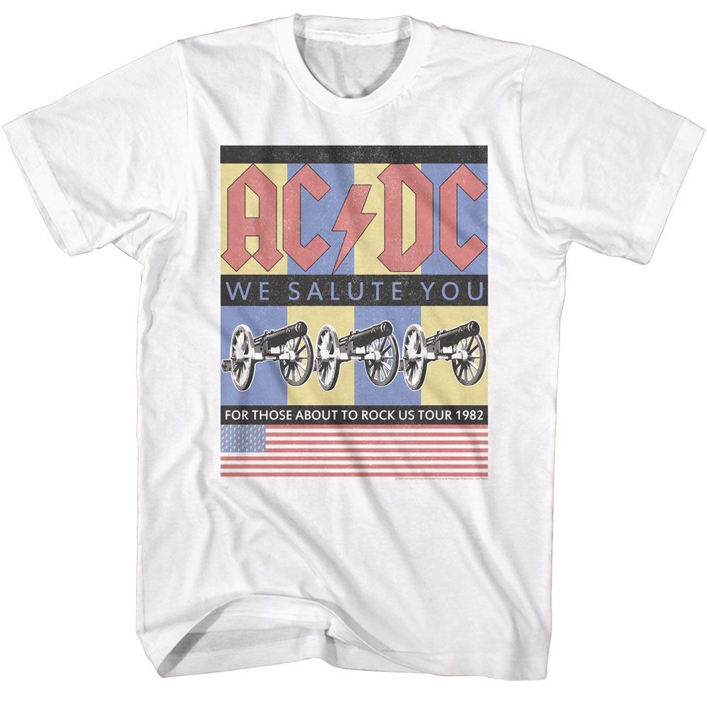 White ACDC T-shirt featuring “We Salute You” artwork with four cannons, retro color blocks, and a US flag design inspired by the 1982 For Those About to Rock tour.