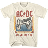Vintage-style cream AC/DC T-shirt featuring a distressed cannon graphic and the text “We Salute You.”