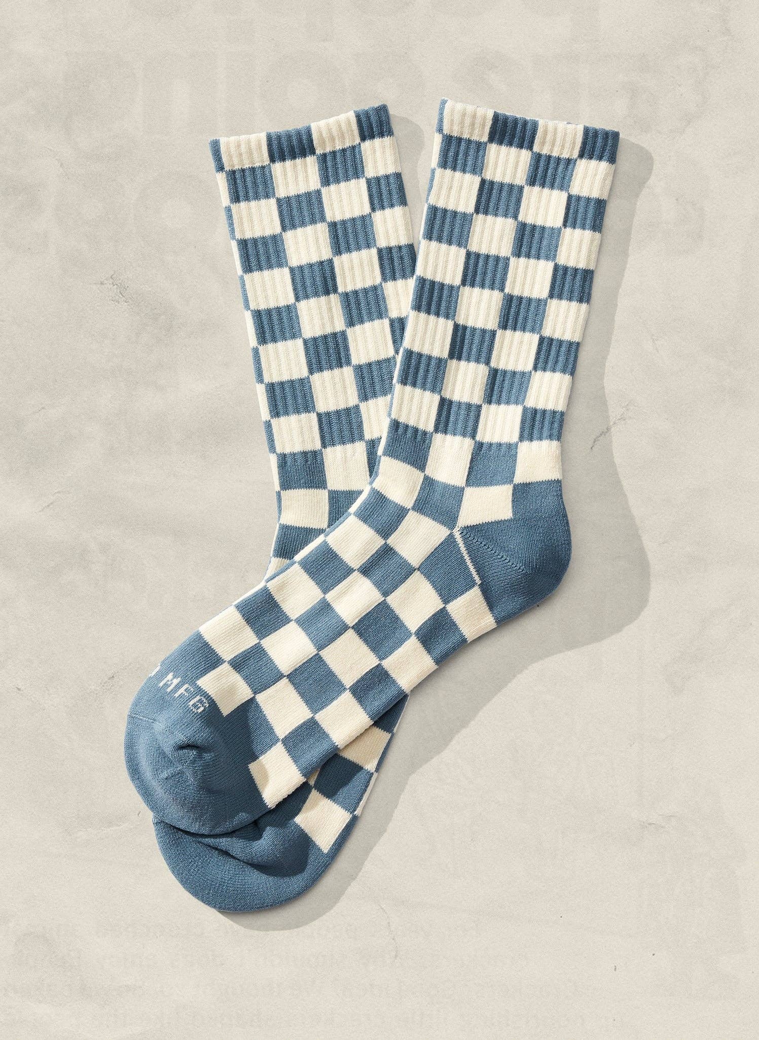 Blue and cream checkered crew socks featuring ribbed knit construction and vintage aesthetic