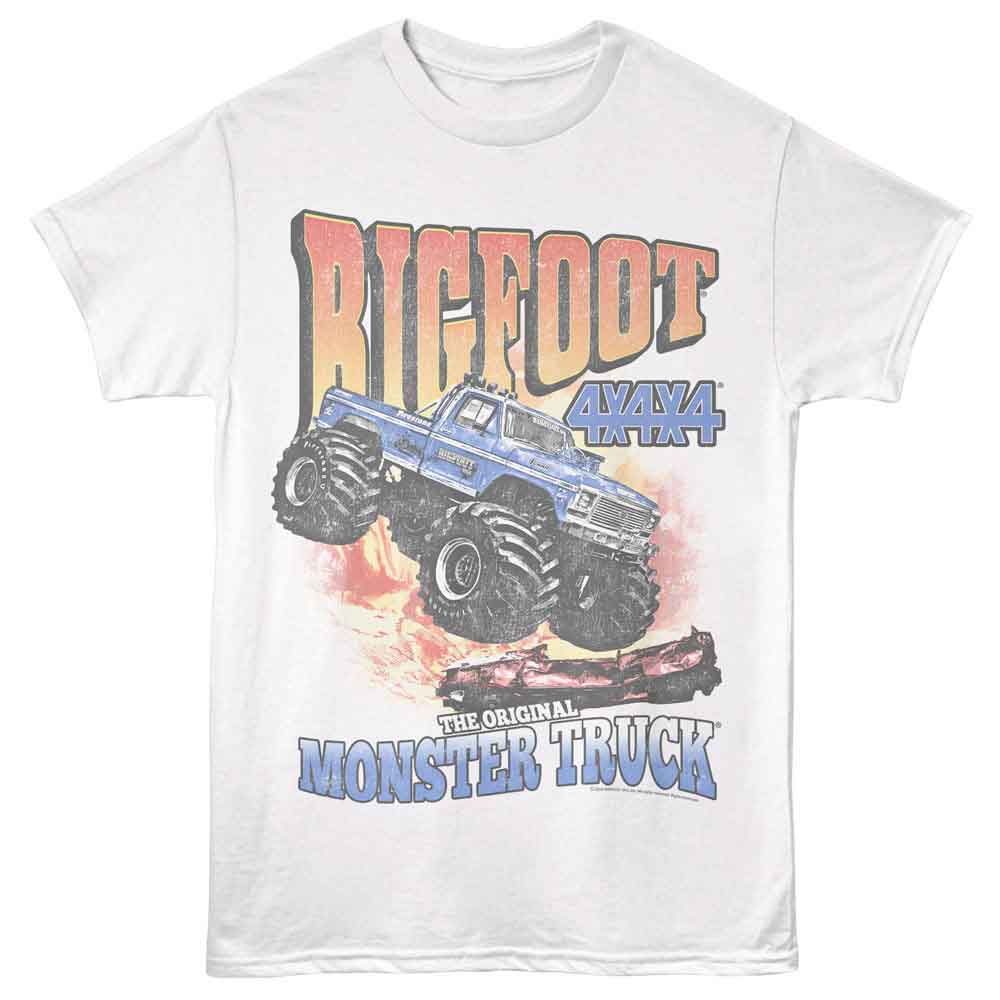 White Bigfoot monster truck T-shirt featuring a blue 4x4 Bigfoot truck jumping with “Bigfoot 4x4x4” text and “The Original Monster Truck” graphic below.