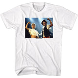 White T-shirt featuring Bill and Ted raising their fists on stage with the word “Excellent” printed beneath the image