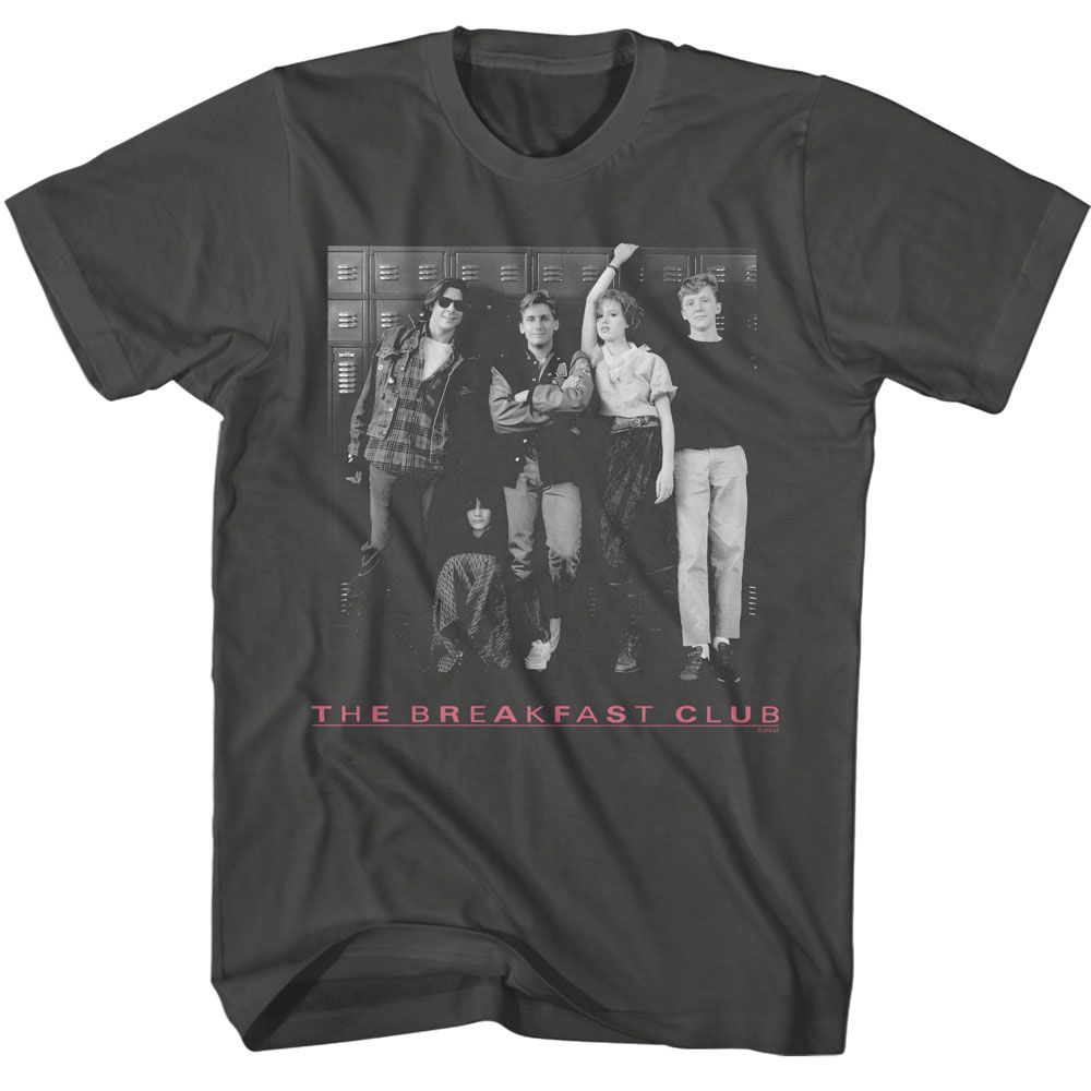 Black T-shirt featuring a black-and-white photo of The Breakfast Club cast standing in front of school lockers with “The Breakfast Club” in pink text below.