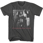 Black T-shirt featuring a black-and-white photo of The Breakfast Club cast standing in front of school lockers with “The Breakfast Club” in pink text below.