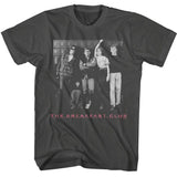 Black T-shirt featuring a black-and-white photo of The Breakfast Club cast standing in front of school lockers with “The Breakfast Club” in pink text below.