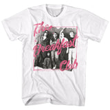 White T-shirt featuring a black-and-white cast photo from The Breakfast Club in front of lockers, overlaid with bright pink handwritten-style script reading “The Breakfast Club.”