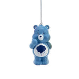 Blue Care Bears Grumpy Bear ornament with storm cloud belly badge hanging from silver string.