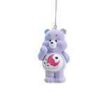 Purple Care Bears ornament with pink moon and cloud belly badge, hanging from a silver loop.