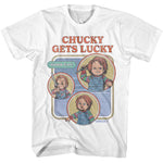 White T-shirt featuring retro-style artwork of Chucky with the text “Chucky Gets Lucky” and “Wanna Play?” in colorful comic-style panels.