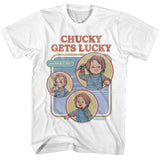 White T-shirt featuring retro-style artwork of Chucky with the text “Chucky Gets Lucky” and “Wanna Play?” in colorful comic-style panels.