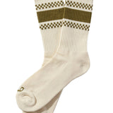 White socks with green and brown checkered patterns on a beige background