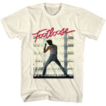 White T-shirt featuring the red Footloose logo above a dance silhouette scene in a sunlit warehouse setting.