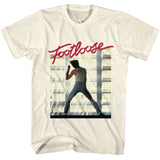 White T-shirt featuring the red Footloose logo above a dance silhouette scene in a sunlit warehouse setting.