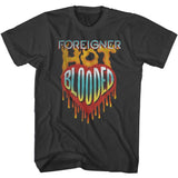 Black Foreigner T-shirt featuring “Hot Blooded” inside a dripping heart graphic with fiery lettering above.