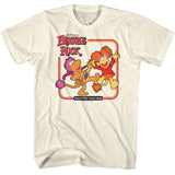 Ivory T-shirt featuring Fraggle Rock characters dancing with the text “Dance Your Cares Away.”
