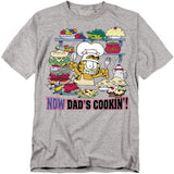 Garfield Now Dad’s Cookin’ T-shirt featuring Garfield cooking in a kitchen filled with food and desserts