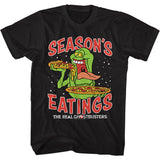 Black T-shirt featuring Slimer from The Real Ghostbusters eating pizza with the text "Season’s Eatings" in festive red lettering.