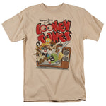 Looney Tunes characters bursting out of a vintage television with Warner Bros Presents logo on a beige T-shirt