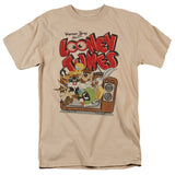 Looney Tunes characters bursting out of a vintage television with Warner Bros Presents logo on a beige T-shirt