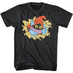 Black Masters of the Universe T-shirt featuring Orko peeking through a torn hole with a red hat, blue hands, and big yellow eyes in a retro cartoon style.