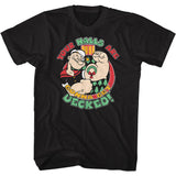 Black T-shirt featuring a festive illustration of Popeye flexing with Christmas trees, a wreath, and the holiday phrase “Your Halls Are Gonna Get Decked!” in red, green, and yellow lettering.