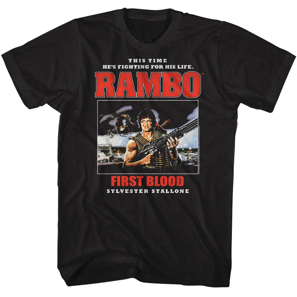 Black Rambo T-shirt featuring Sylvester Stallone as John Rambo holding a rifle with the quote “This time he’s fighting for his life” from First Blood (1982).