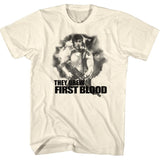 Vintage cream Rambo T-shirt featuring Sylvester Stallone as John Rambo with the quote “They Drew First Blood” from the 1982 action classic.