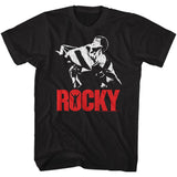 Black T-shirt featuring Rocky Balboa draped in the American flag with bold red “ROCKY” text below.