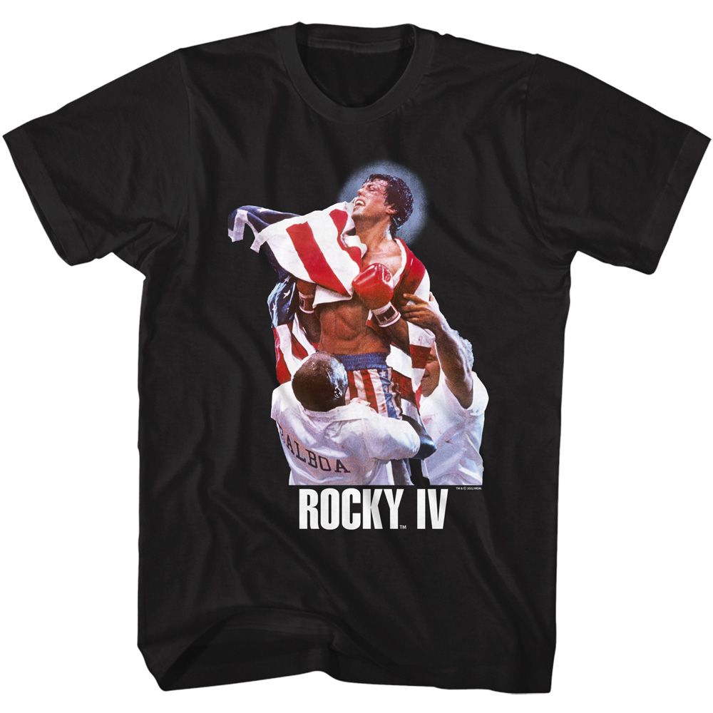 Black Rocky IV T-shirt featuring Rocky Balboa celebrating victory wrapped in the American flag with “Rocky IV” text below.