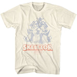 Natural cream Masters of the Universe T-shirt featuring Skeletor sitting on a throne with faded vintage-style artwork and bold Skeletor text.