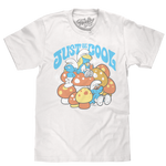 White graphic T-shirt featuring Smurf characters with colorful mushroom artwork and “Just Be Cool” slogan