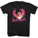 Black graphic t-shirt featuring Ted Logan inside a pink heart with playful white doodle hearts and Bill & Ted’s Excellent Adventure branding.