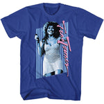 Bright blue T-shirt featuring a blue-toned photo of Tina Turner against vertical stripes, with her name written in large pink script along the right side.