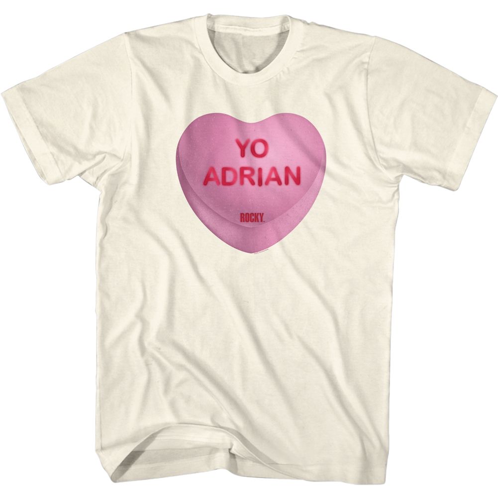 Cream-colored Rocky t-shirt featuring a pink candy heart with the words “Yo Adrian” in red lettering.